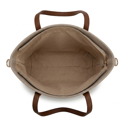 Open beige handbag with brown handles on a white background
