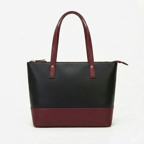 Black and maroon handbag on a white background